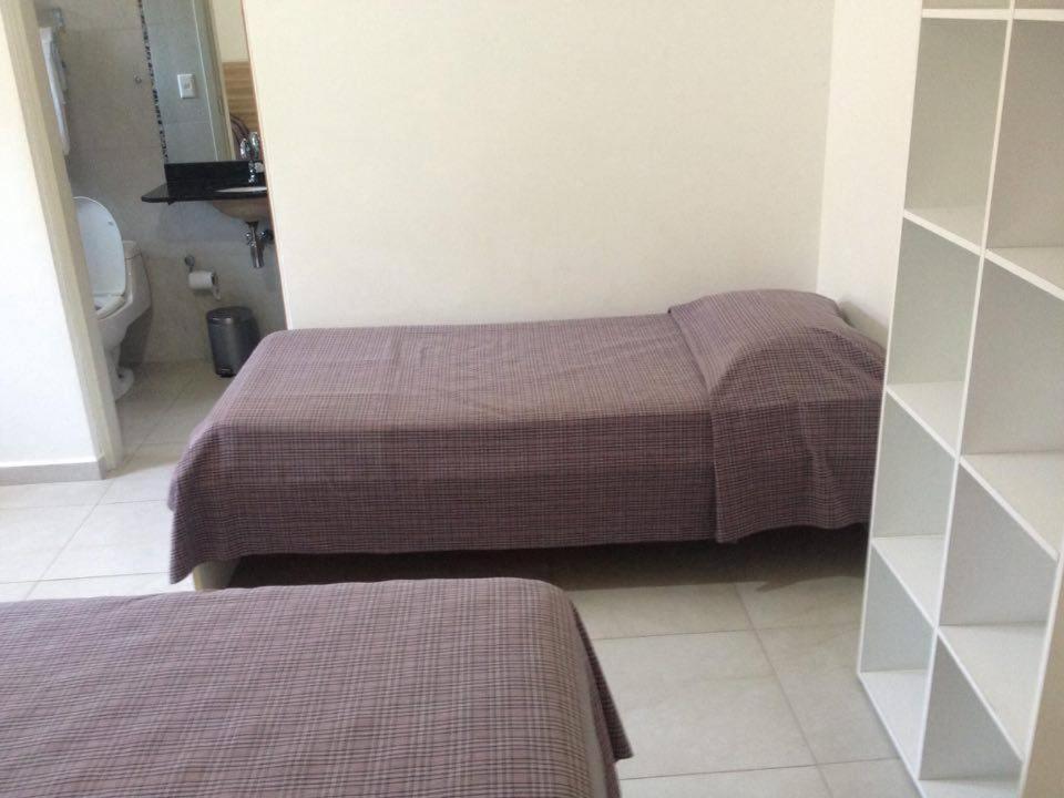 Pousada Parque Suites Estacionamento E Piscina Guarujá Værelse billede